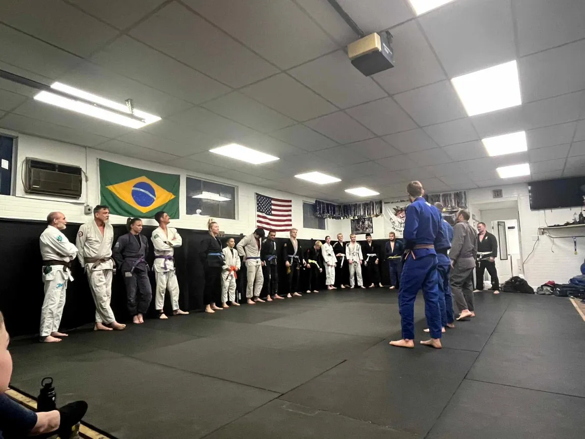 Students lined up on the mat at Arte Suave Jiu Jitsu Academy